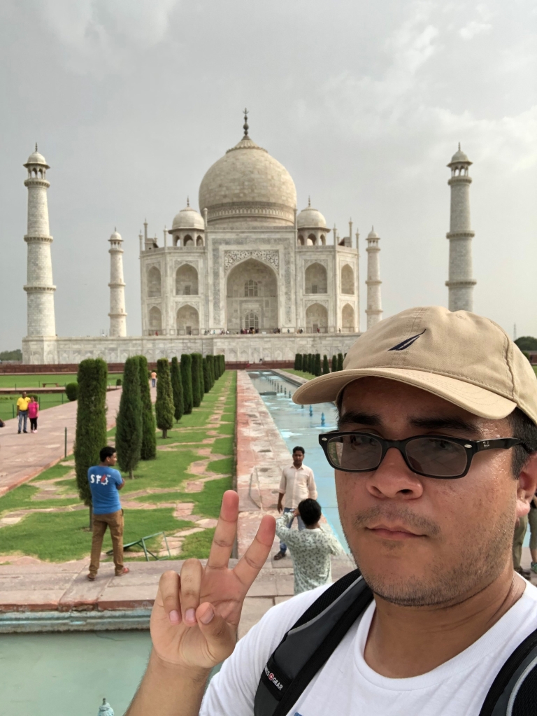 Andres Cavillo stands in front of the Taj Mahal