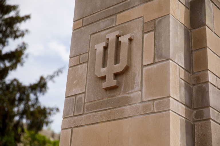 the iu trident on a limestone building