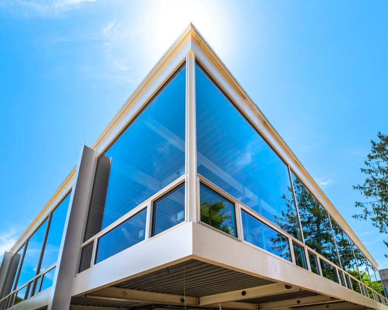 The corner of the glass-lined Mies van der Rohe inspired building at IU Bloomington