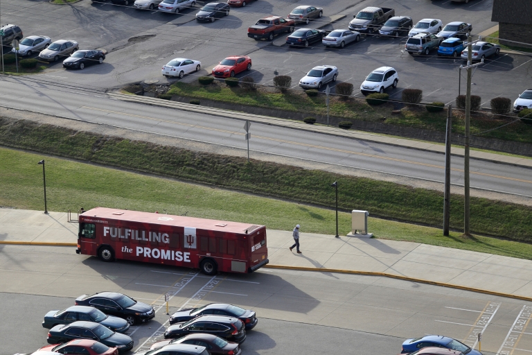 Campus bus parked at the stadium lot
