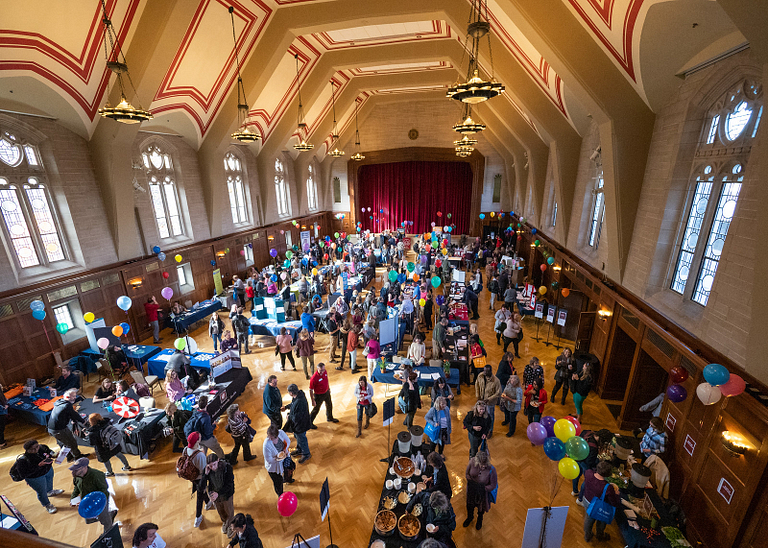 Alumni Hall in the IMU full of people attending the annual Health and Benefits Fair