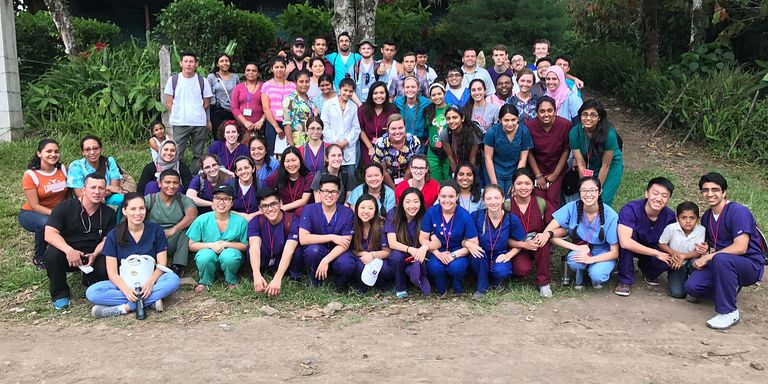 A large group of IUPUI students poses with staff from a Nicaraguan clinic.
