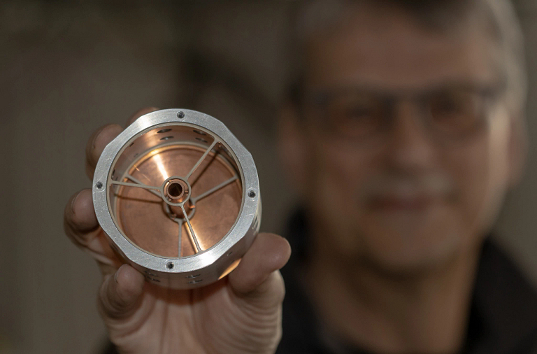 Martin Jarrold holds a disassembled ion trap
