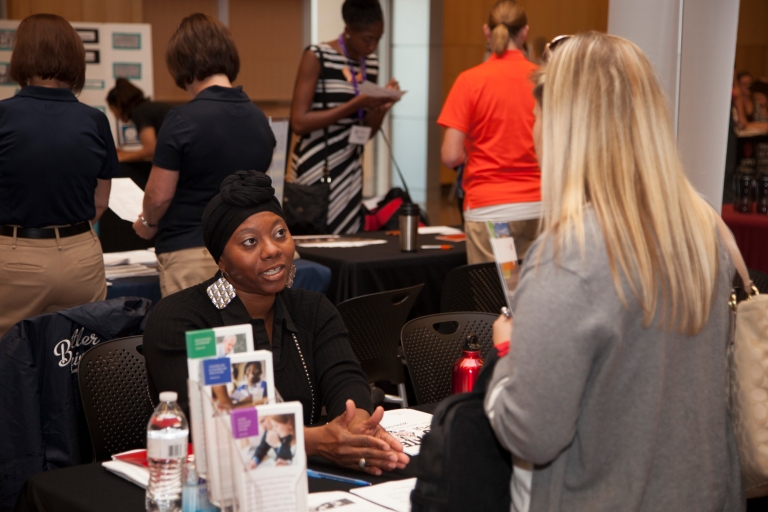 Women talking at Graduate Expo