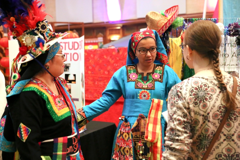 Students speak at a cultural booth at the IU World's Fare